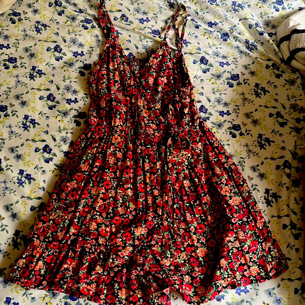 This is a romper it fits like and XXS  has a little bow in the front